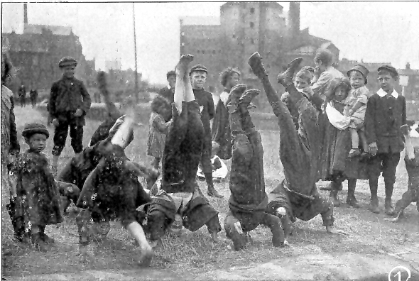 Children performing for pennies before boat trippers,<br>19th August 1911