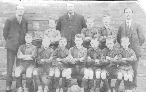 Tewkesbury Holy Trinity School football team with<br>George Dyson and fassistant masters 1906-7 (Roche)